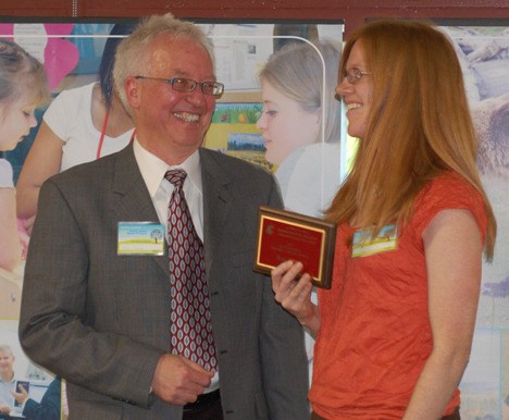 Tess White receives her award.