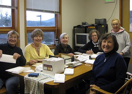 Friends of the Library members gather to mail the 2010 Annual Membership Drive letter. From left to right