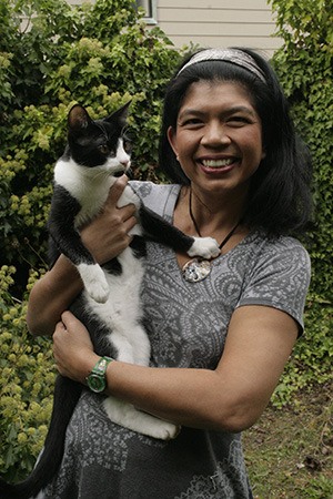 Swaran Dhaliwal with her kitten Flash. He and his brother Lightning were adopted from the Orcas Animal Shelter.