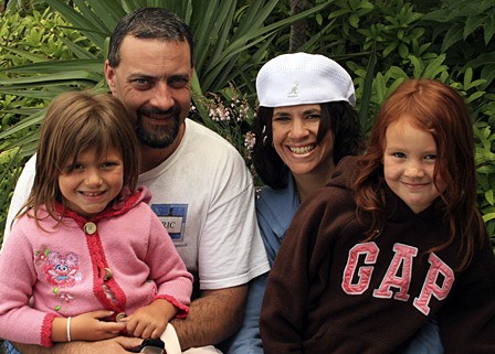 Eric Whitehead and Karen Plunkett-Whitehead with their daughters Erica (l) and Tori.