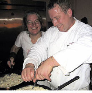 Anne Garfield and Bill Patterson hard at work in the kitchen.