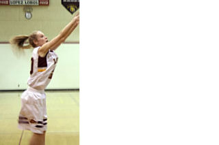 Left: Sarah Stanley gets a shot off. Helen Sanders photo.  Above: Lexy Ogden battles for position. Deanna Brant photo.