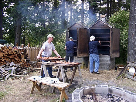 Lions club master smokers preparing to load the next batch of salmon for the annual bbq.