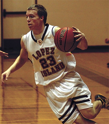 Lopez junior Keldon Jardine drives the ball down the court during the Jan. 14 game against Lummi.
