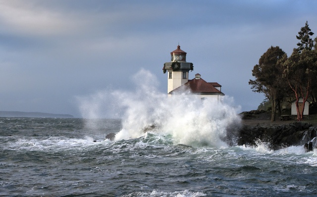 Lime Kiln Lighthouse gets buffeted by waves on the west side of San Juan Island.