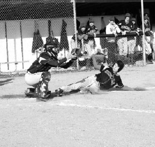 Seaburn Gieger tries to steal home in the first game of a double-header with the Concrete Lions.