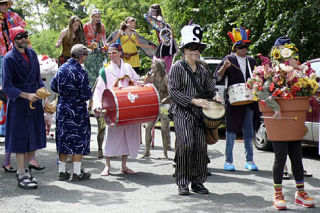 The Summer Solstice parade begins to march from the Odd Fellows Hall into Eastsound.