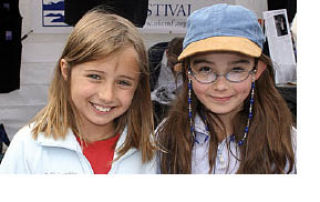Frances Walls joins her friend Hana Nieutz selling cookies to benefit Children’s Hospital in Seattle.