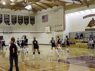 Lopez fights Lummi at the net.