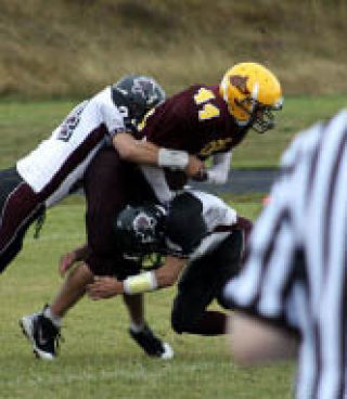 Lopez defense bring down a Lummi player at the Oct. 4 game.