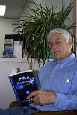 George Karnikis with his new book