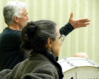 Robert Hall and Jean Henigson instruct middle school students to perform in “The Dastardly Doctor Devereaux.”
