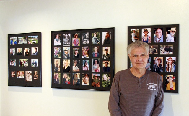 Mandi Johnson photoGlassett with photos he has on display on the wall of Enzo’s.