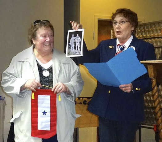 Mamie Forbes (left) receiving the Blue Star Banner in honor of her son’ Shawn’s military service.