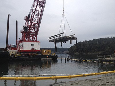 Creosote pilings and a pier being removed from Barlow Bay on Lopez Island.