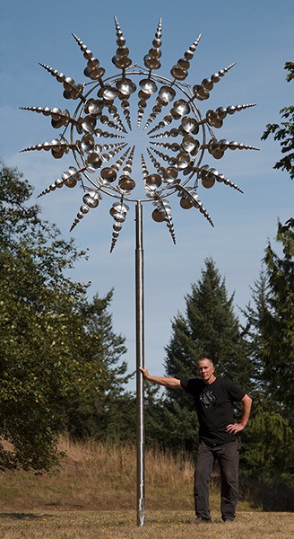 Orcas artist Tony Howe with one of his sculptures.