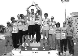The Lopez boy’s track team celebrates their second place finish over 26 other teams at the 1B State Track and Field Championships. Left to right: Assistant coach Mike Strom