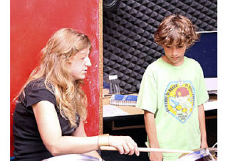 Darlene Pohl instructs a young drummer at The Funhouse.