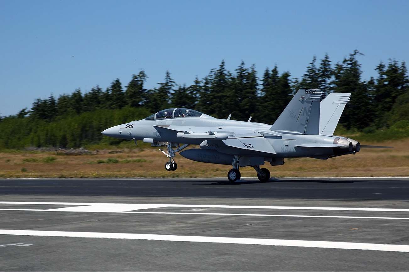 140711-N-DC740-041 OAK HARBOR, Wash. (July 11, 2014) An EA-18G Growler assigned to Electronic Attack Squadron (VAQ) 129 lands on Naval Air Station Whidbey Island’s Ault Field. VAQ-129 is the U.S. Navy’s fleet replenishment squadron for EA-6B Prowlers and EA-18G Growlers. (U.S. Navy photo by Mass Communication Specialist 2nd Class John Hetherington/Released)
