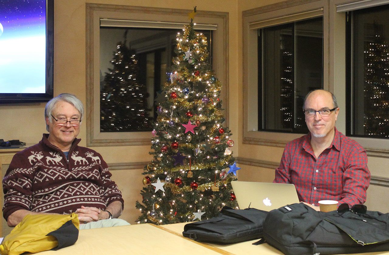 Staff photo/Hayley Day                                Vince Deaucinas, the OPALCO board president, and Jay Kimball, a member of the public, sit at the Dec. 6 OPALCO Tea Talk at the San Juan IslandLibrary.