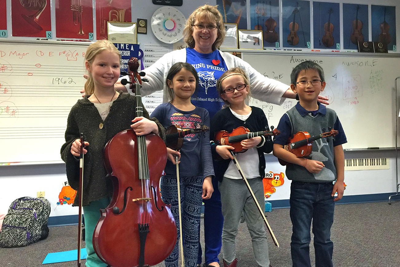 Beginning strings class after school Islands' Sounder