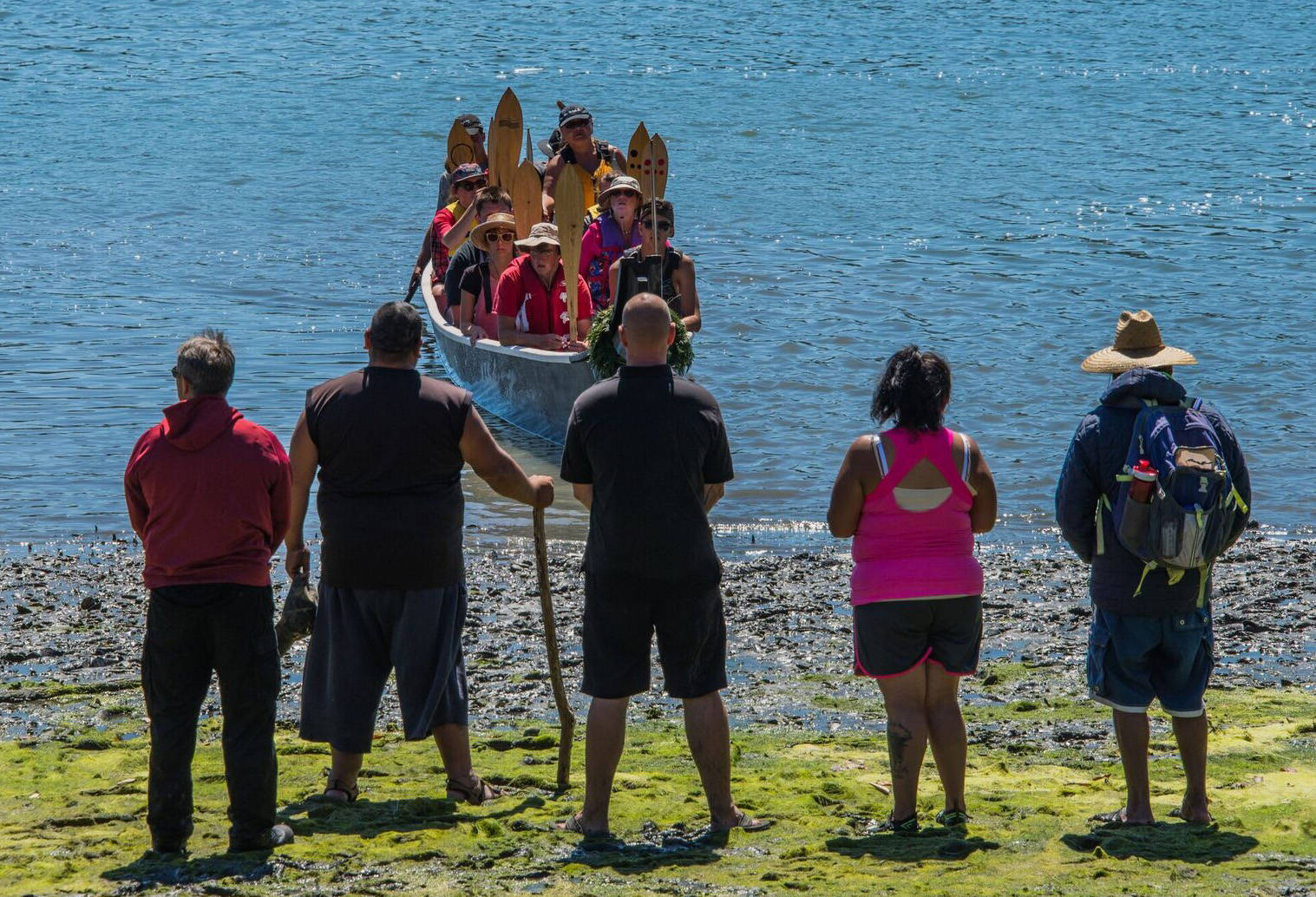 Contributed photo/Chris Teren                                Islanders watch as tribal canoes row to the shores of English Camp.