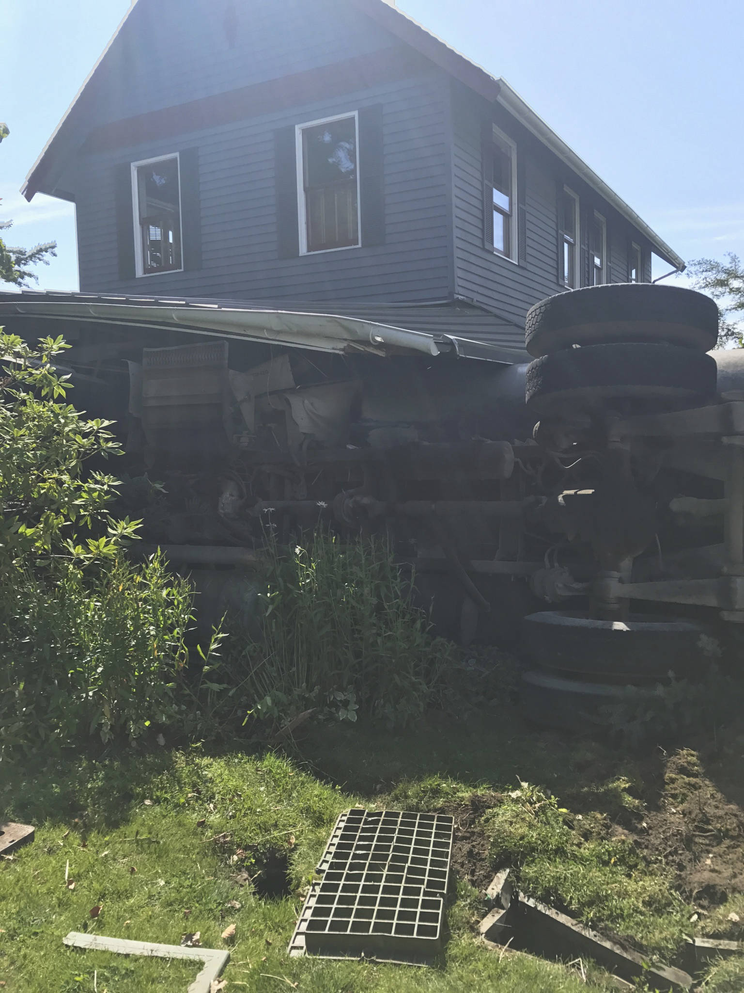 Dump truck crashes into house