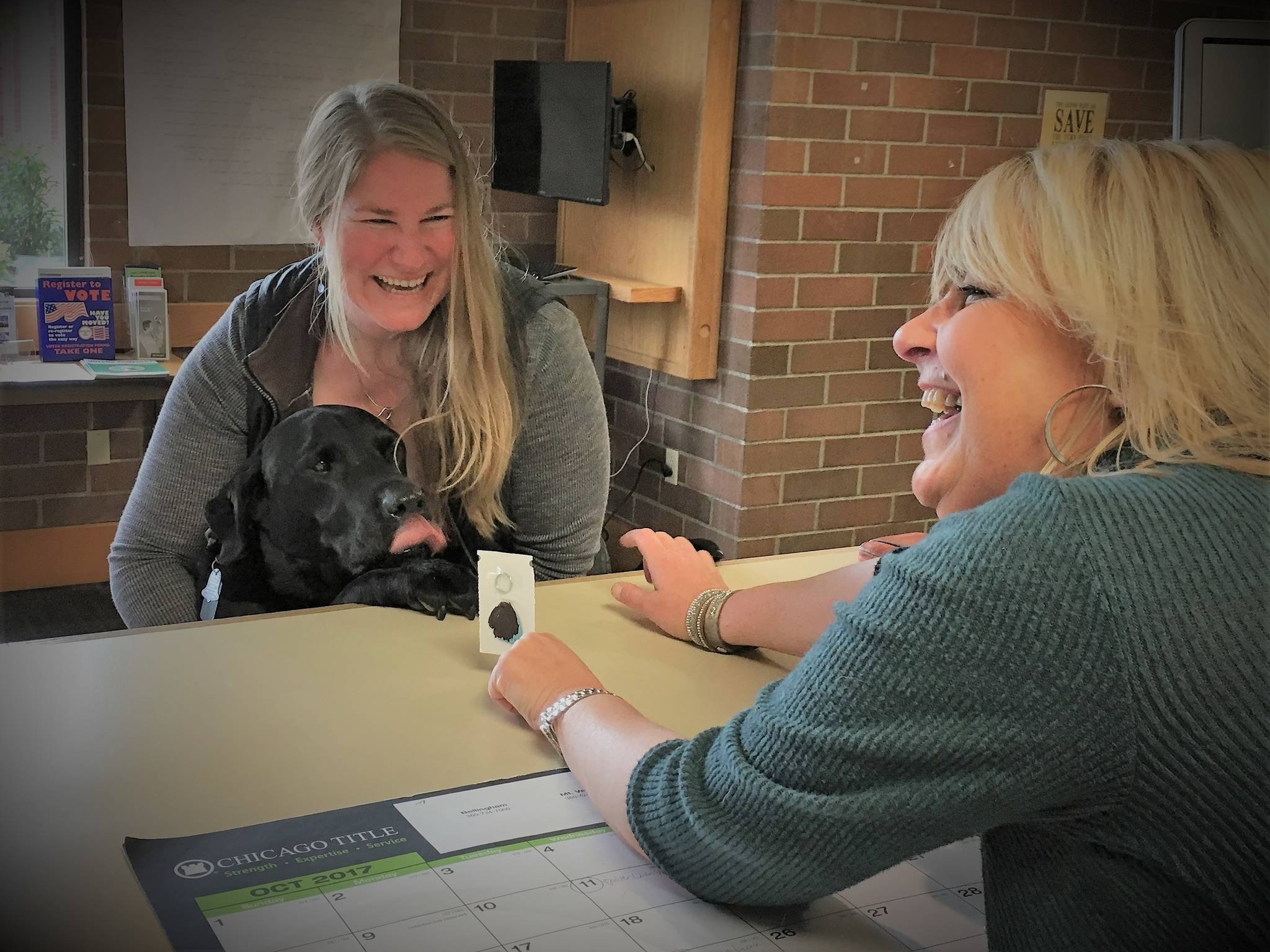 Tucker, a 13-year-old black lab received the first dog license of 2018.
