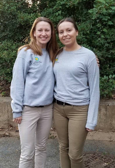 Alyssa Johns (right) at the National Zoo with lion keeper Rebecca Stites.