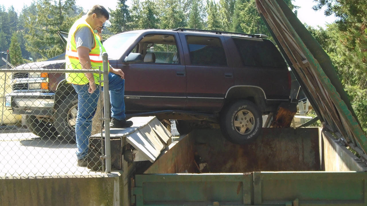 SUV dangles dangerously at Lopez Dump