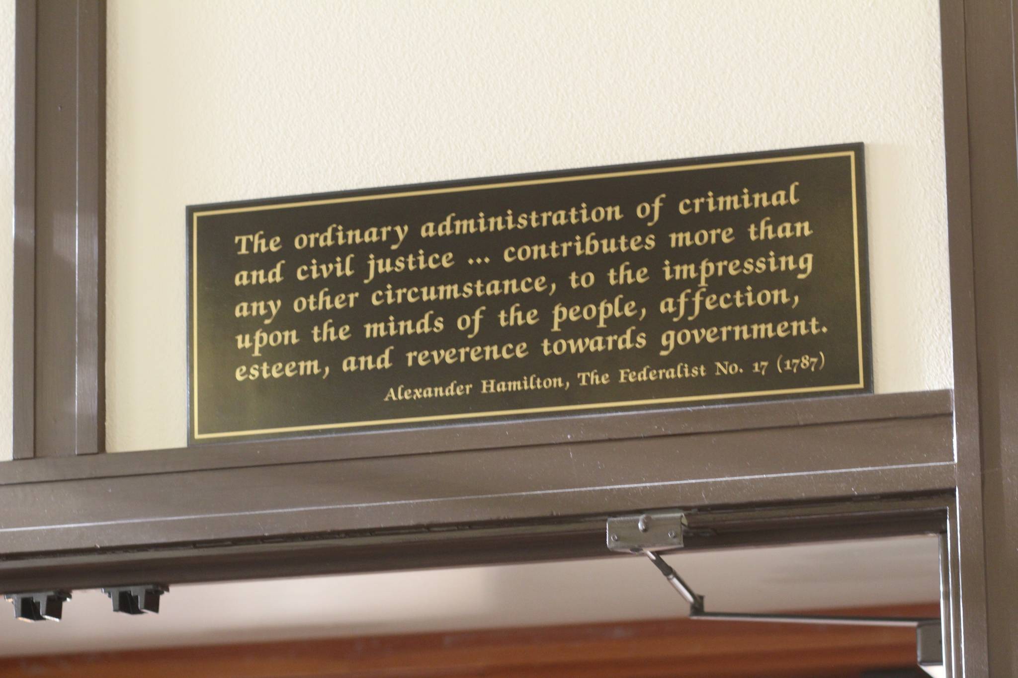 Staff photo/Hayley Day                                A quote from the Federalist Papers hangs in Judge Andrew’s court.