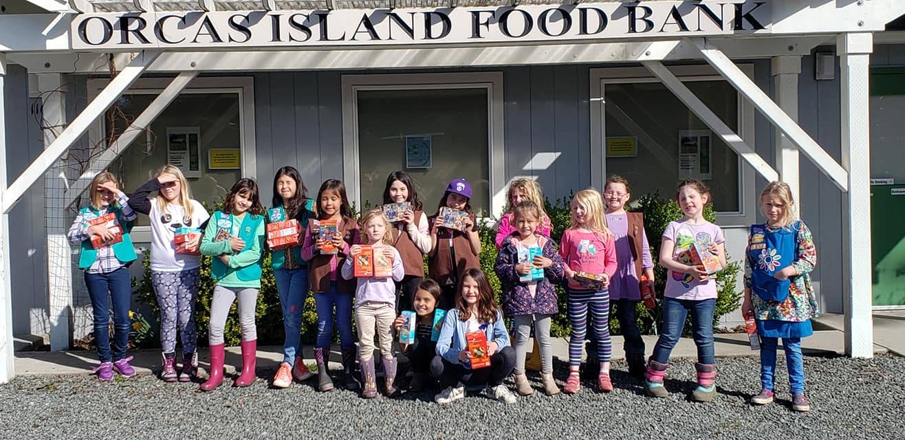 Girl Scouts donate cookies to Orcas Food Bank