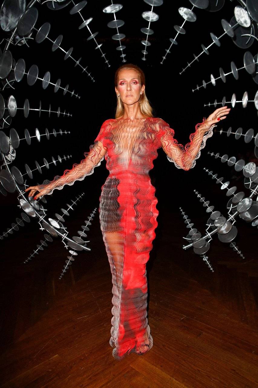 Ethereal Celine Dion posing alongside Anthony Howe’s hypnotic ‘Omniverse’ sculpture on the runway of Iris van Herpen’s Couture show. Styled by Pepe Muñoz.