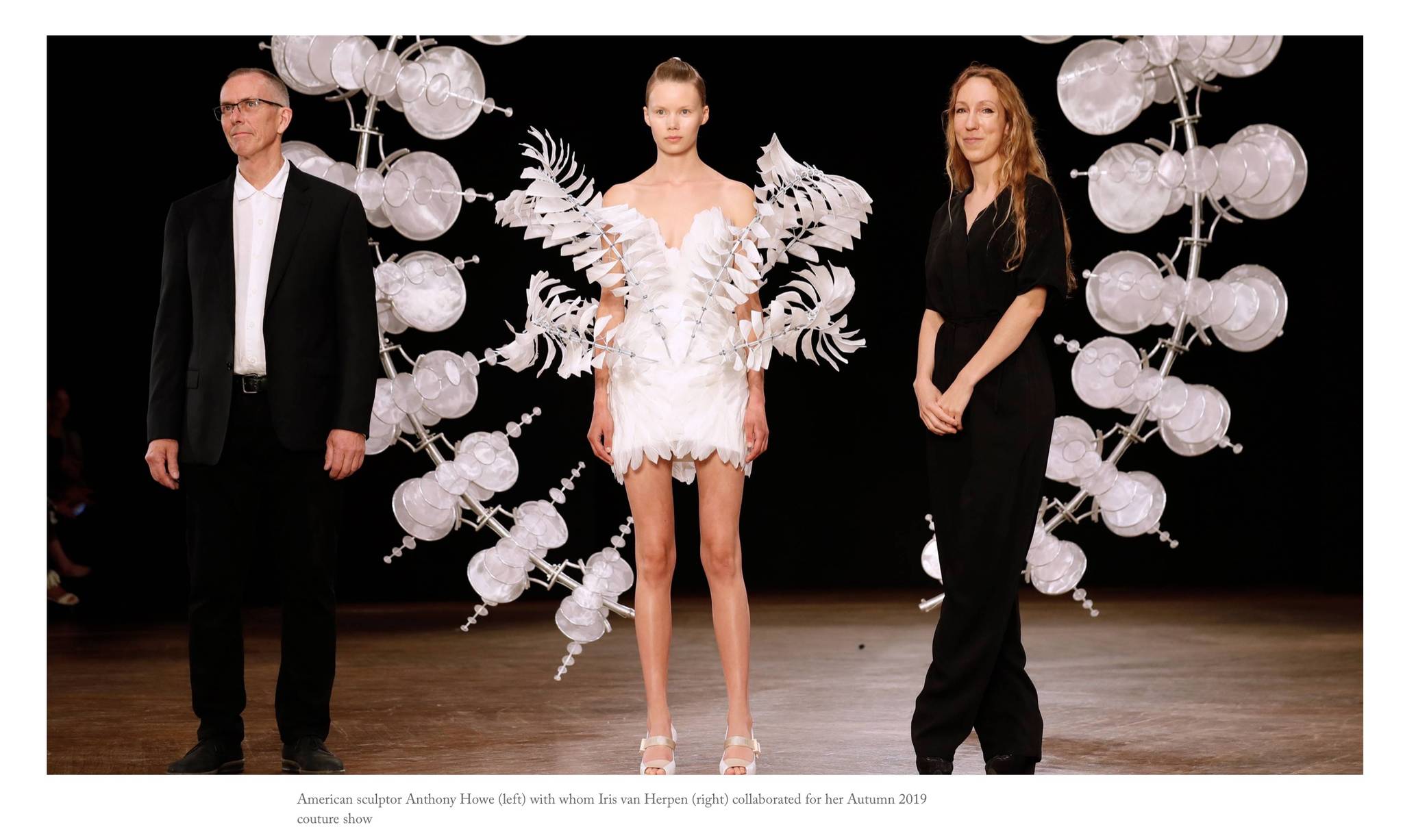 Contributed photo from The New York Times, featuring the finale “Infinity” dress (center).