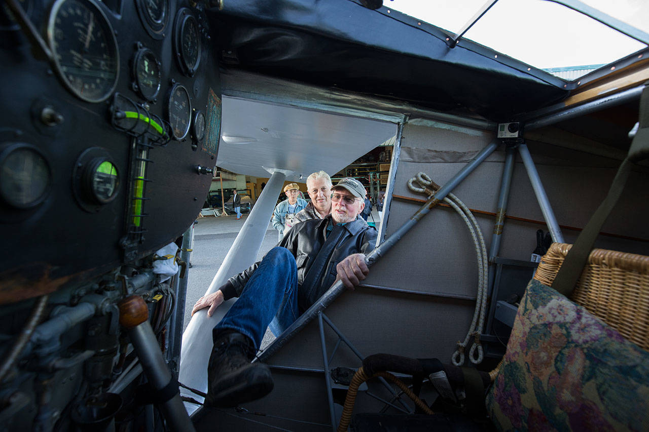 Getting into the cockpit is no easy feat as pilot Ron Fowler stretches a leg into John Norman’s replica of the Spirit of St. Louis before taking the plane out on its first flight July 28. (Andy Bronson / The Herald)