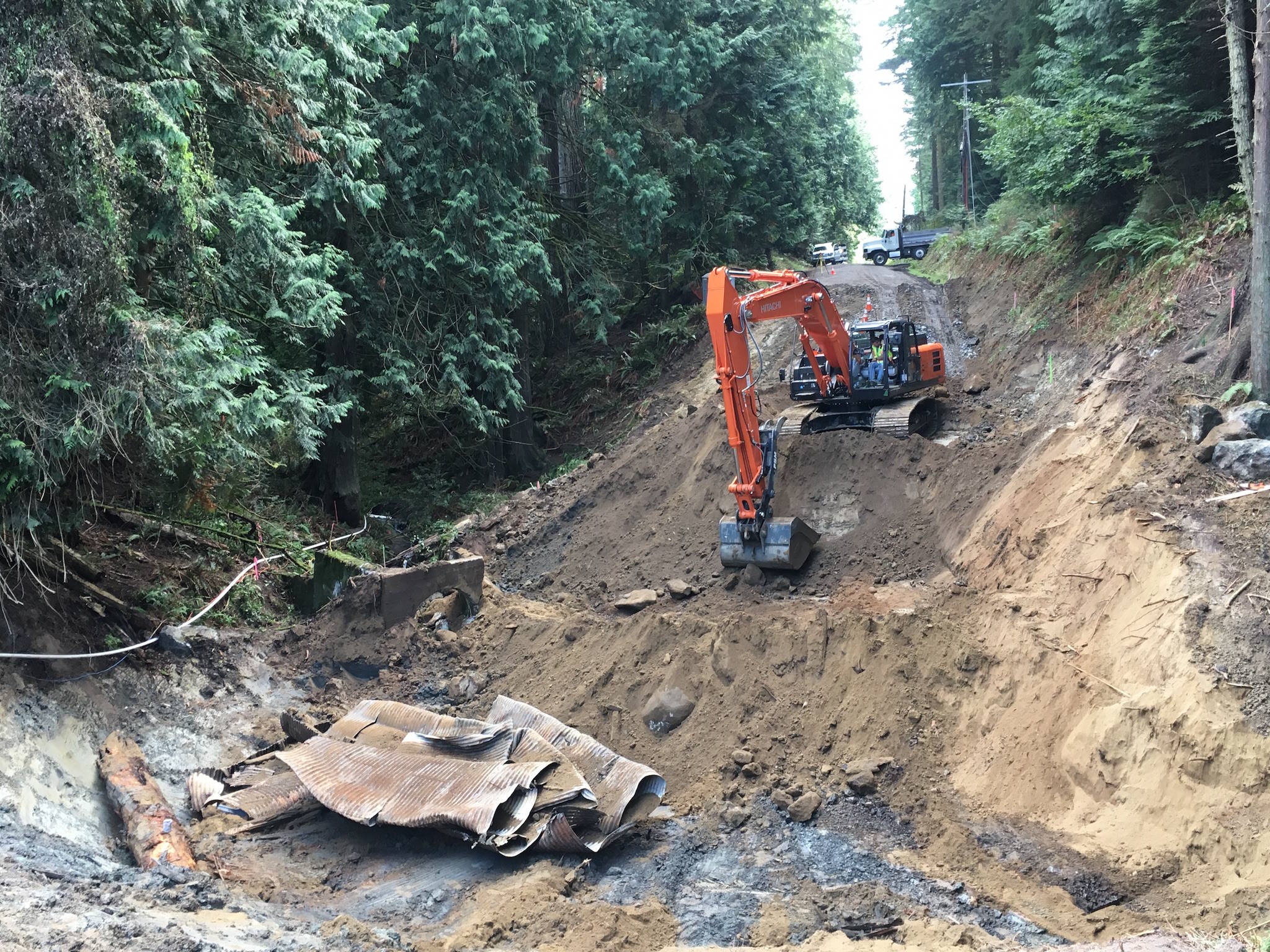 Contributed photo | Excavators remove material at the intersection of West Beach and Enchanted Forest roads