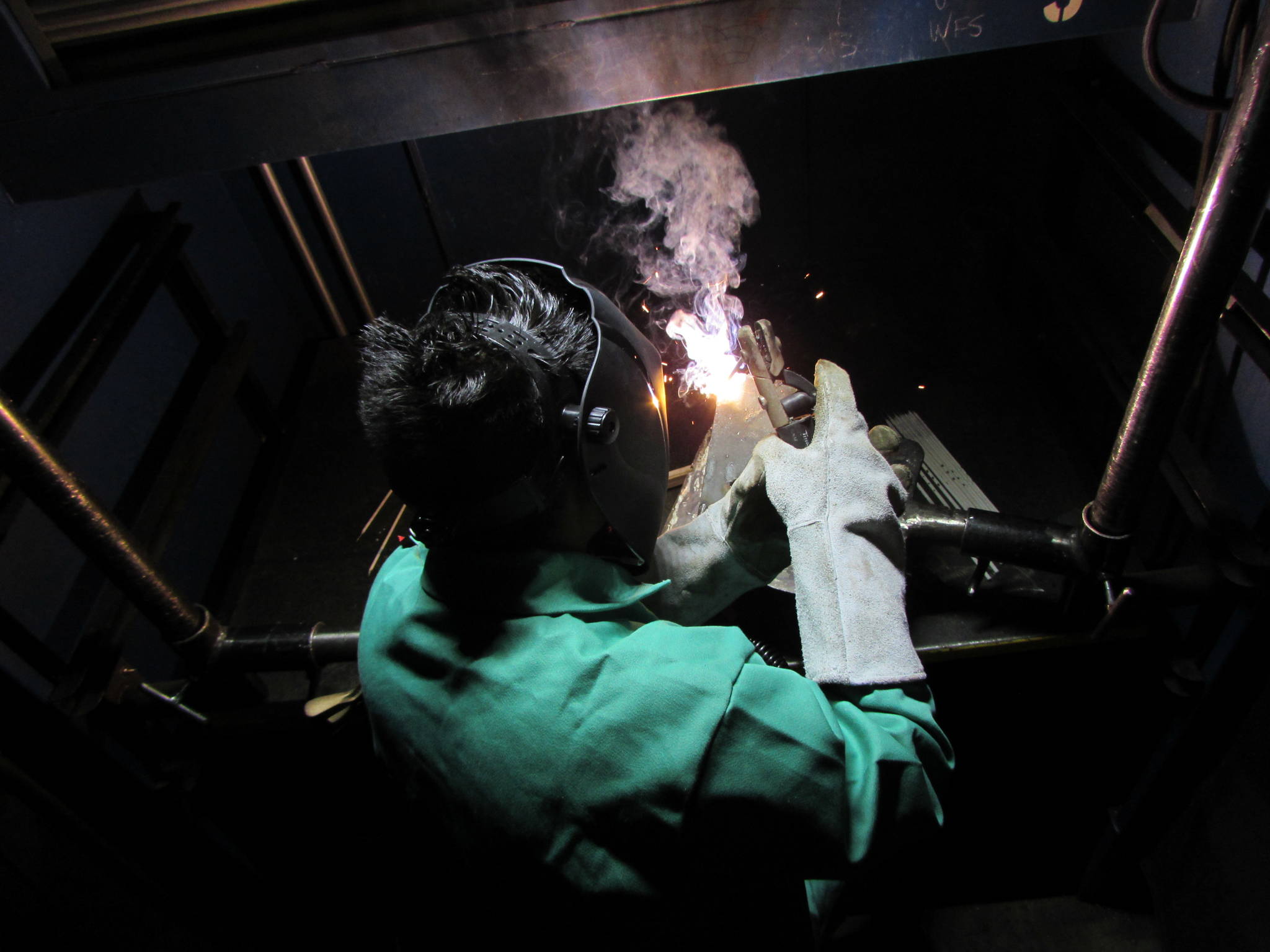 A student learning to weld.