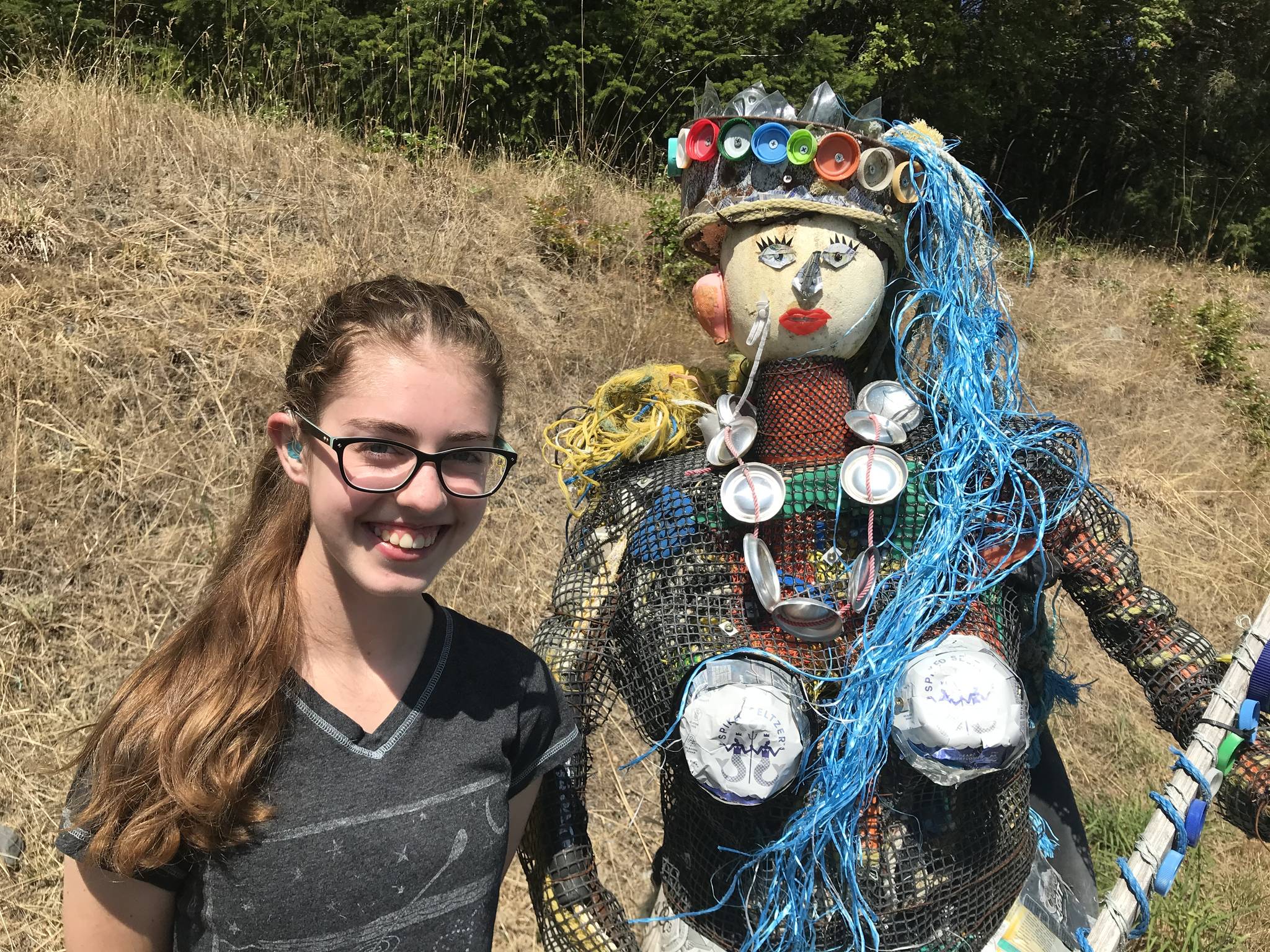Contributed photo                                Kaia at the Lopez Dump with a mermaid made of litter.