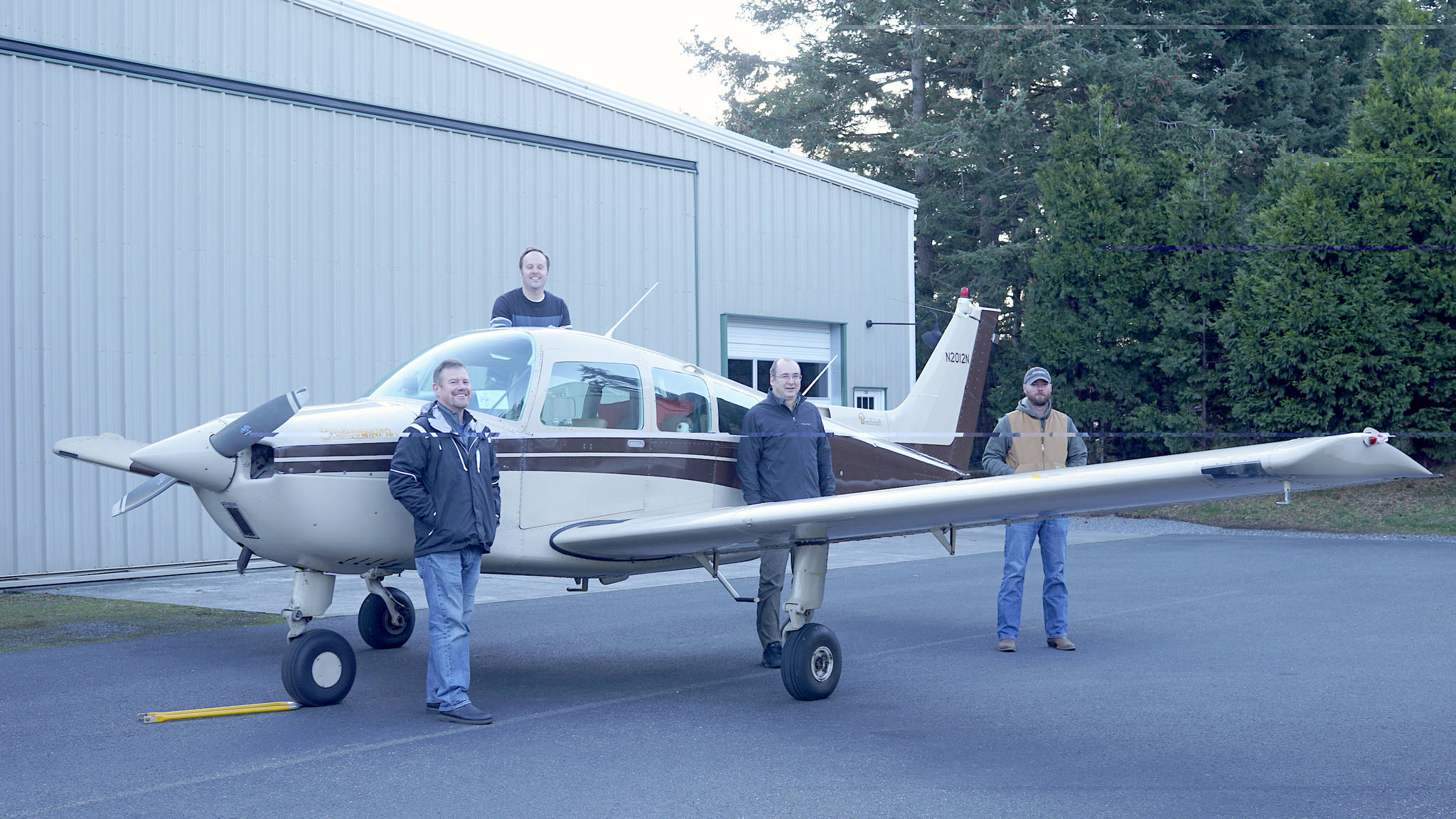 Laura Kussman/Staff photo
From right to left: Tony Simpson, David Billings, David Janecek and Ken Loock stand with the Airhawks Flight Club airplane — a 1993 Beechcraft Sundowner purchased in the summer of 2019 to provide more training options for student pilots and increases flying opportunities for current pilots.