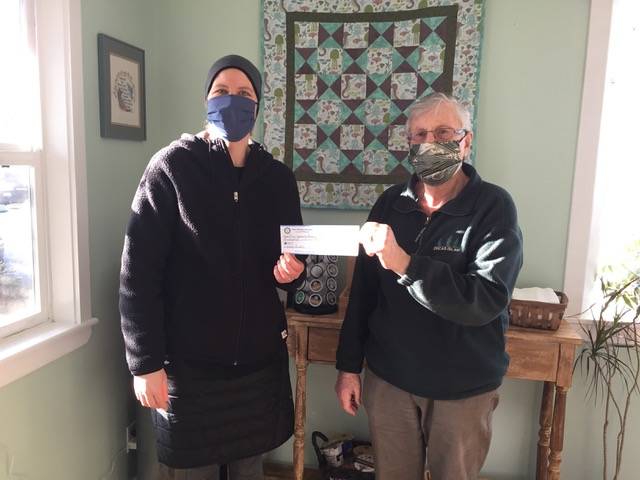 Contributed photo
Stan Liebenberg (right), Secretary/Treasurer of the Orcas Rotary Club presents a $500 check to Erin O Dell, Director of the Community Resources Center, to help those in need in our community.