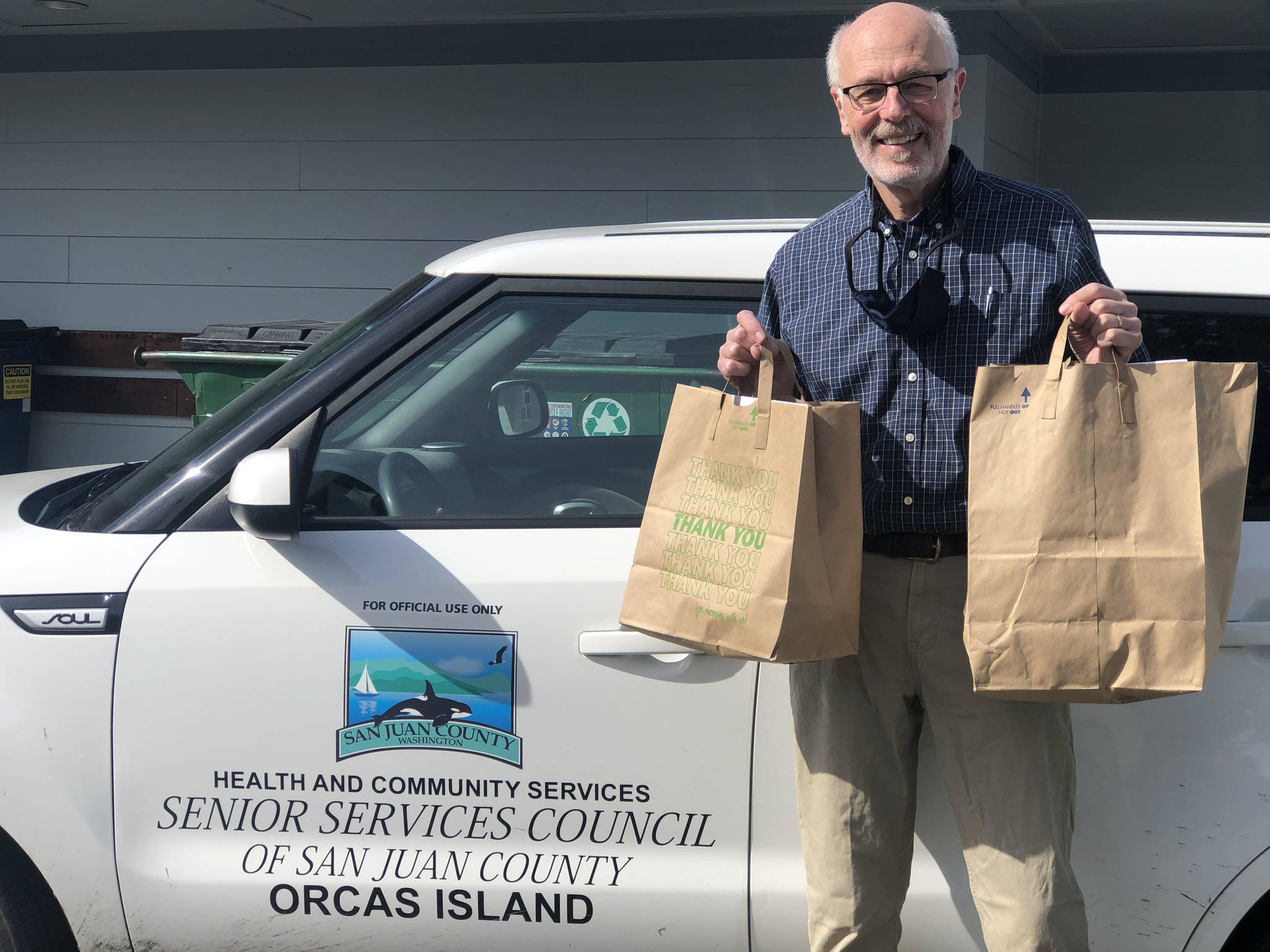 Colleen Smith/staff photo
Celebrity volunteer Orcas Chamber of Commerce Executive Director Lance Evans helped deliver hot meals as part of the March for Meals.