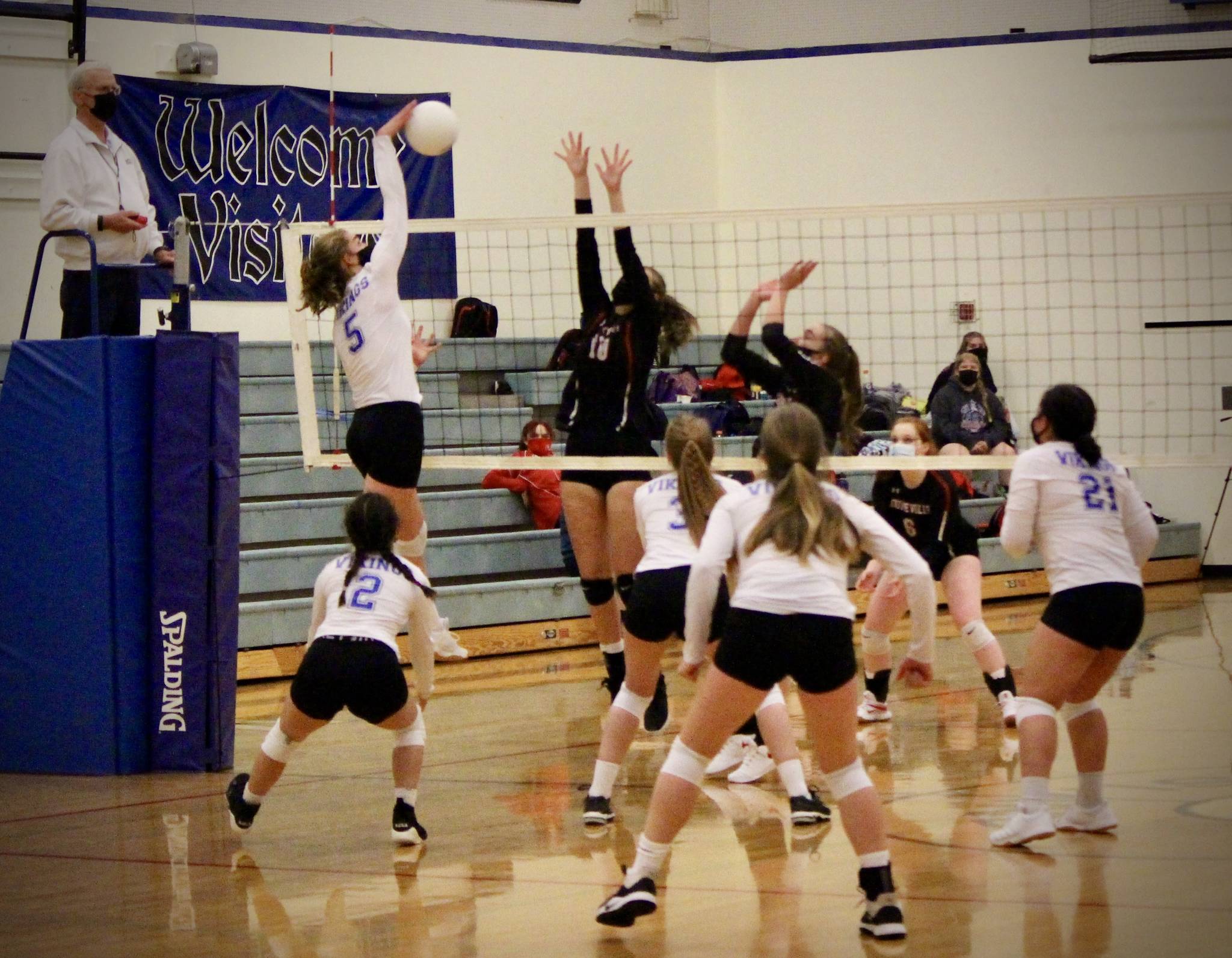Corey Wiscomb/contributed photo
The Lady Vikings cover the net while Bethany Carter smacks the ball down for a kill against the Wolves.