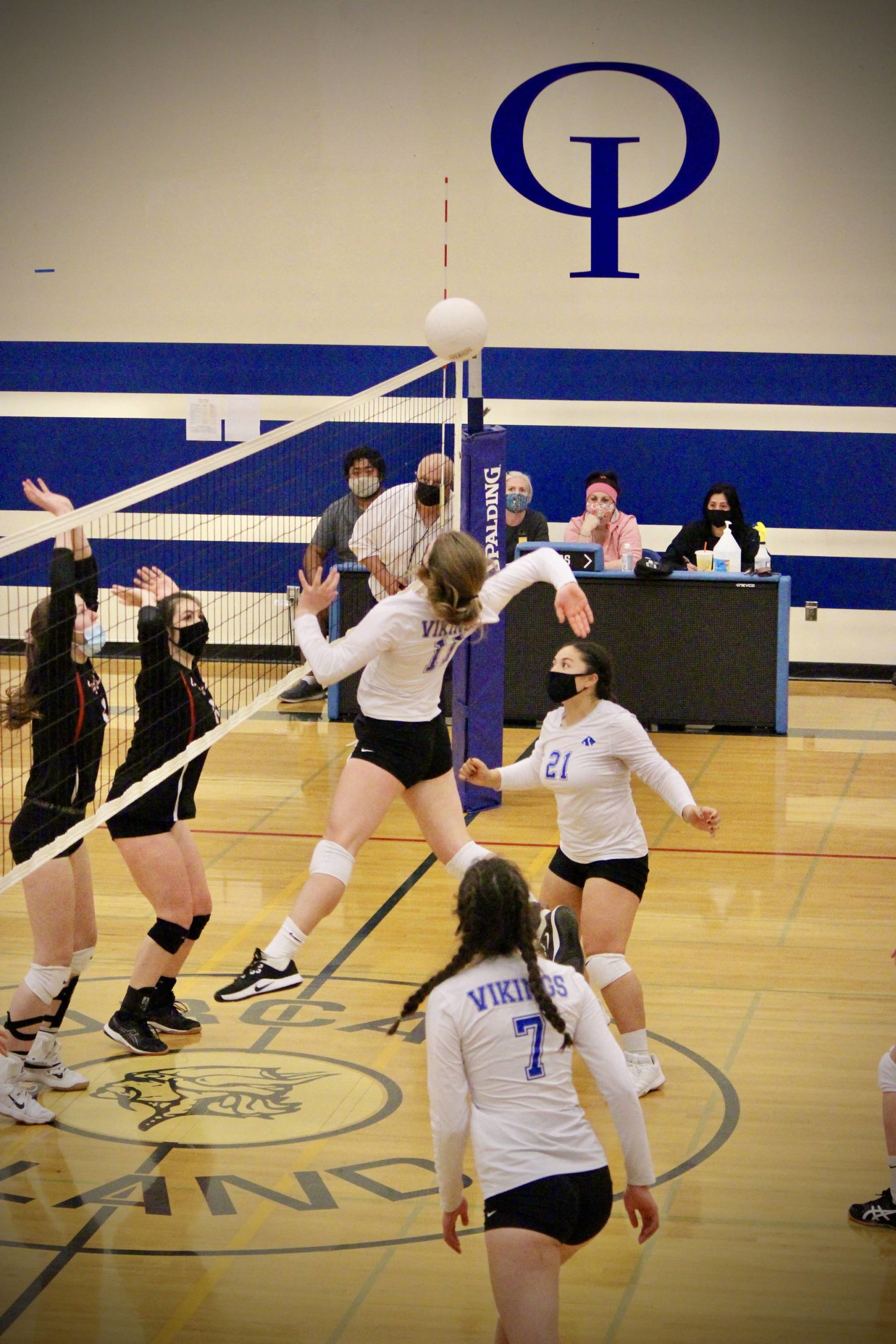 Corey Wiscomb/contributed photo
Tayla Malo (21) and Seraphine Knapp (7) stay ready as Lindsey Simpson (11) swings for the kill.