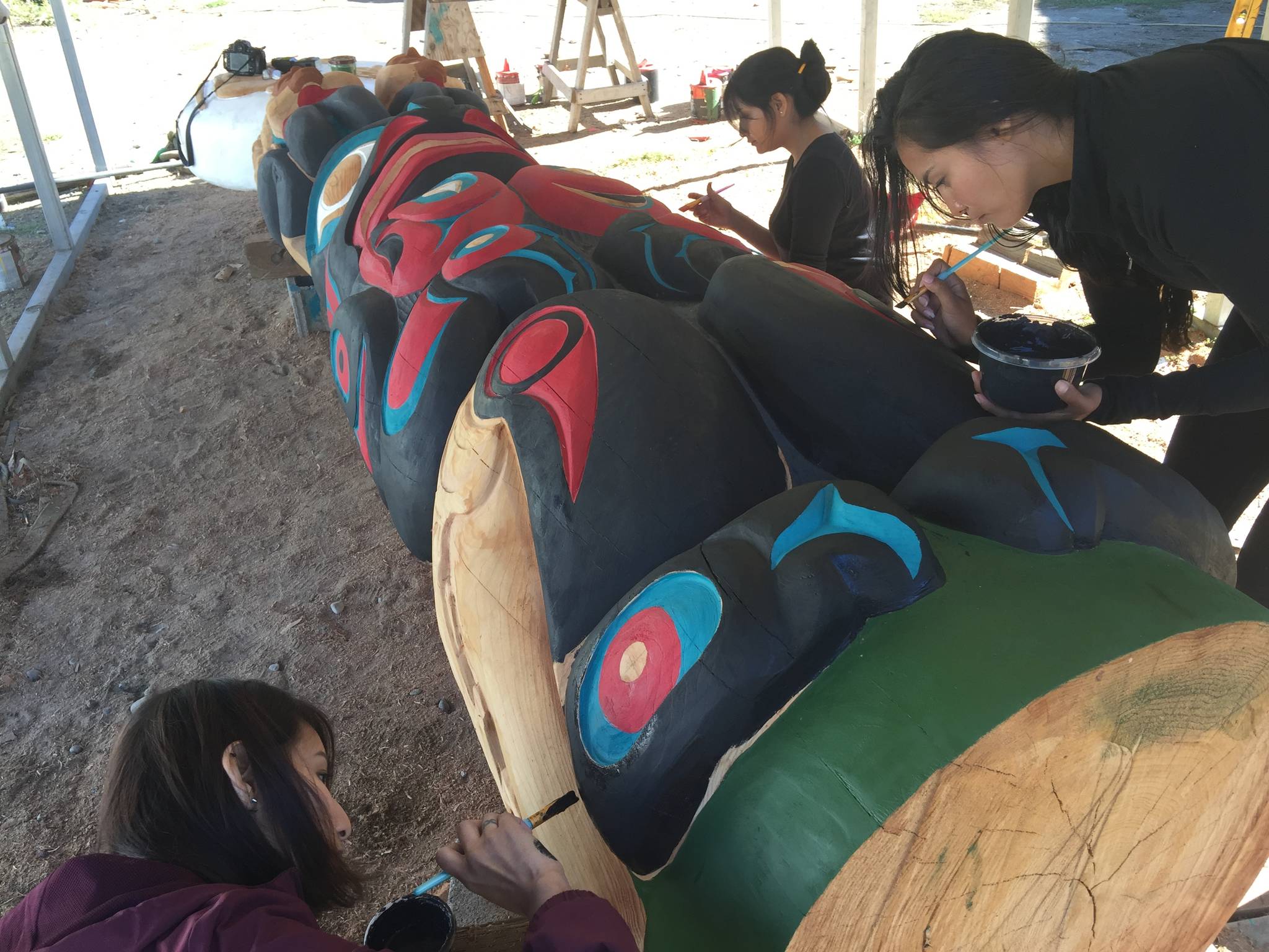 Contributed photo
House of Tears Carvers painting the Anthropocene Pole in 2018.