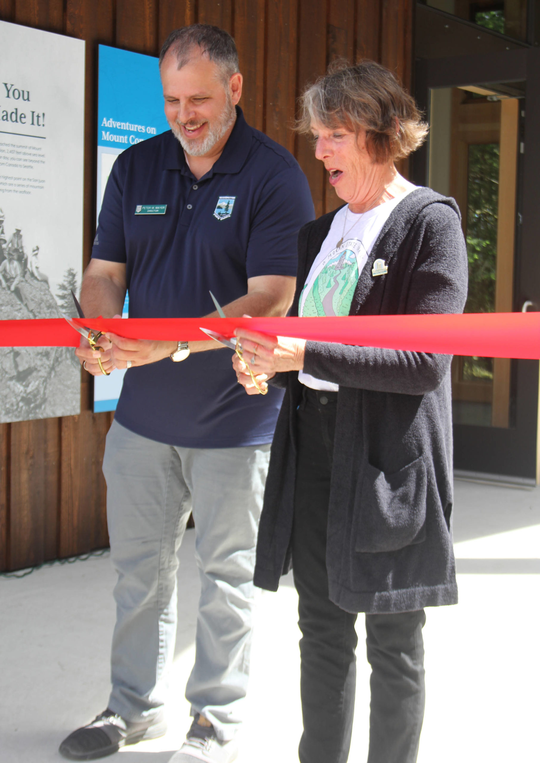 Colleen Smith/staff photo
State Parks Director Peter Mayer and Friends of Moran president Sandi Talt cutting the ribbon to the new visitors’ center on June 18.