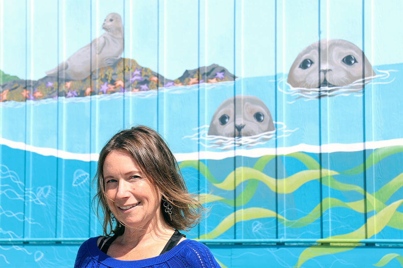 Mandi Johnson/staff photo
Stephanie Iverson in front of the mural she painted on the Wausau Station Building.