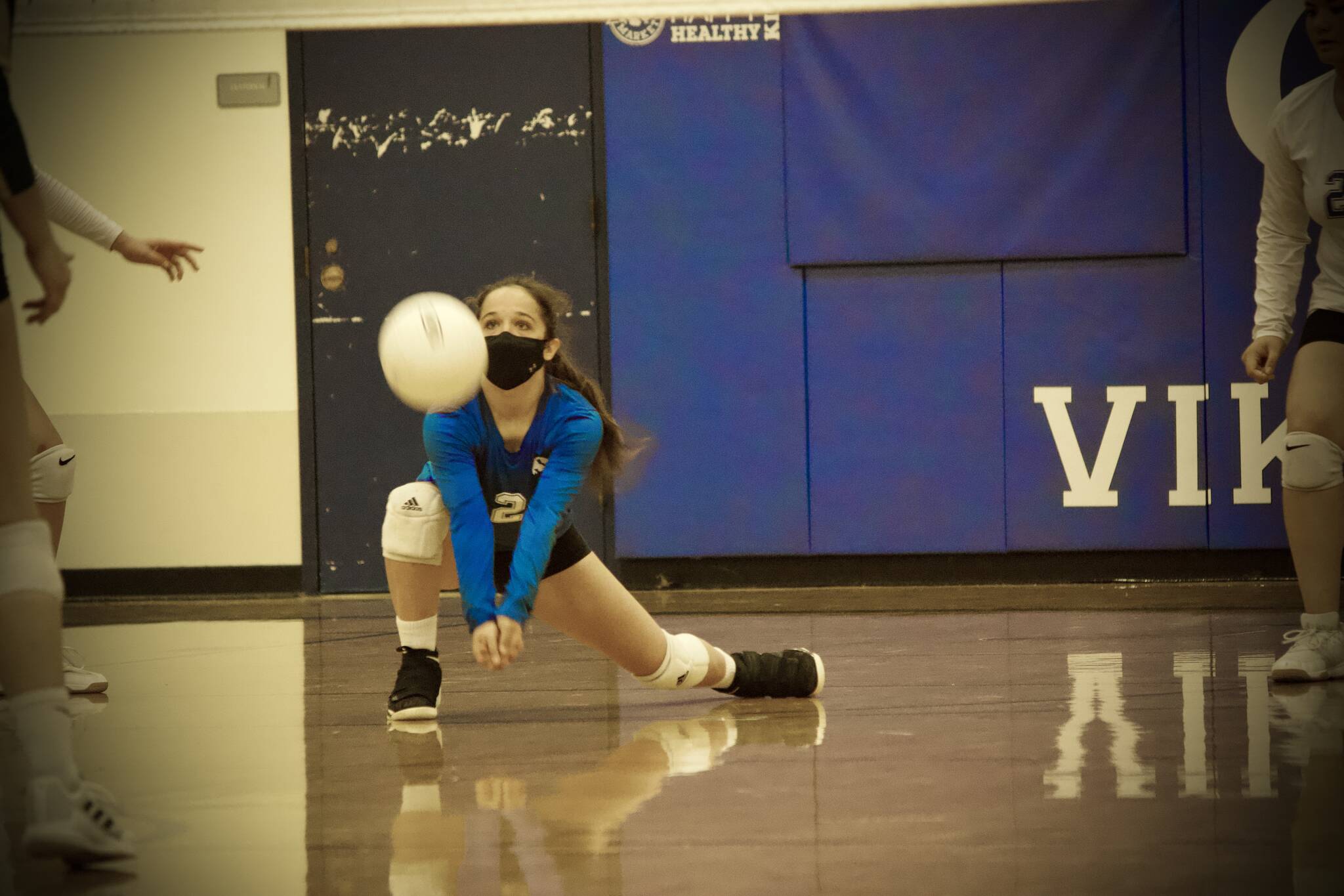 Corey Wiscomb photo
Sophomore Milana Schneider gets low to keep the ball up and in play for her Vikings.
