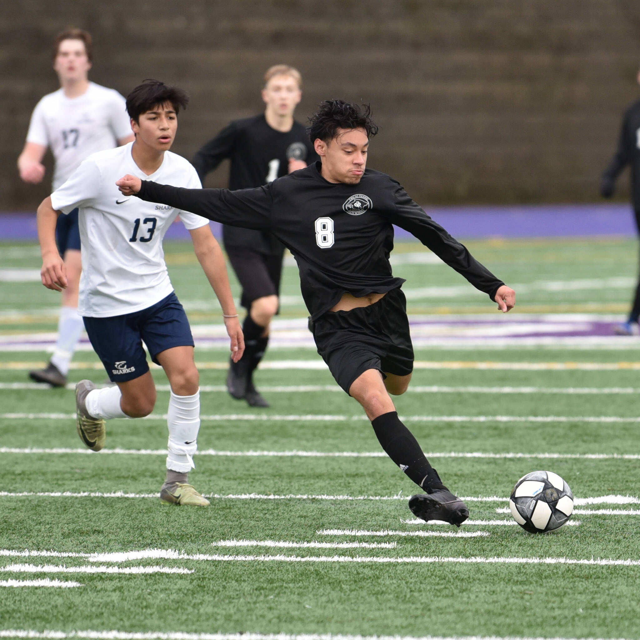 Chris Sutton photo
With the might and fury of a jungle cat Senior William Ibarra smashes a shot on goal for the Orcas Vikings. The win has now put Orcas in the Final Four of the State Playoffs.