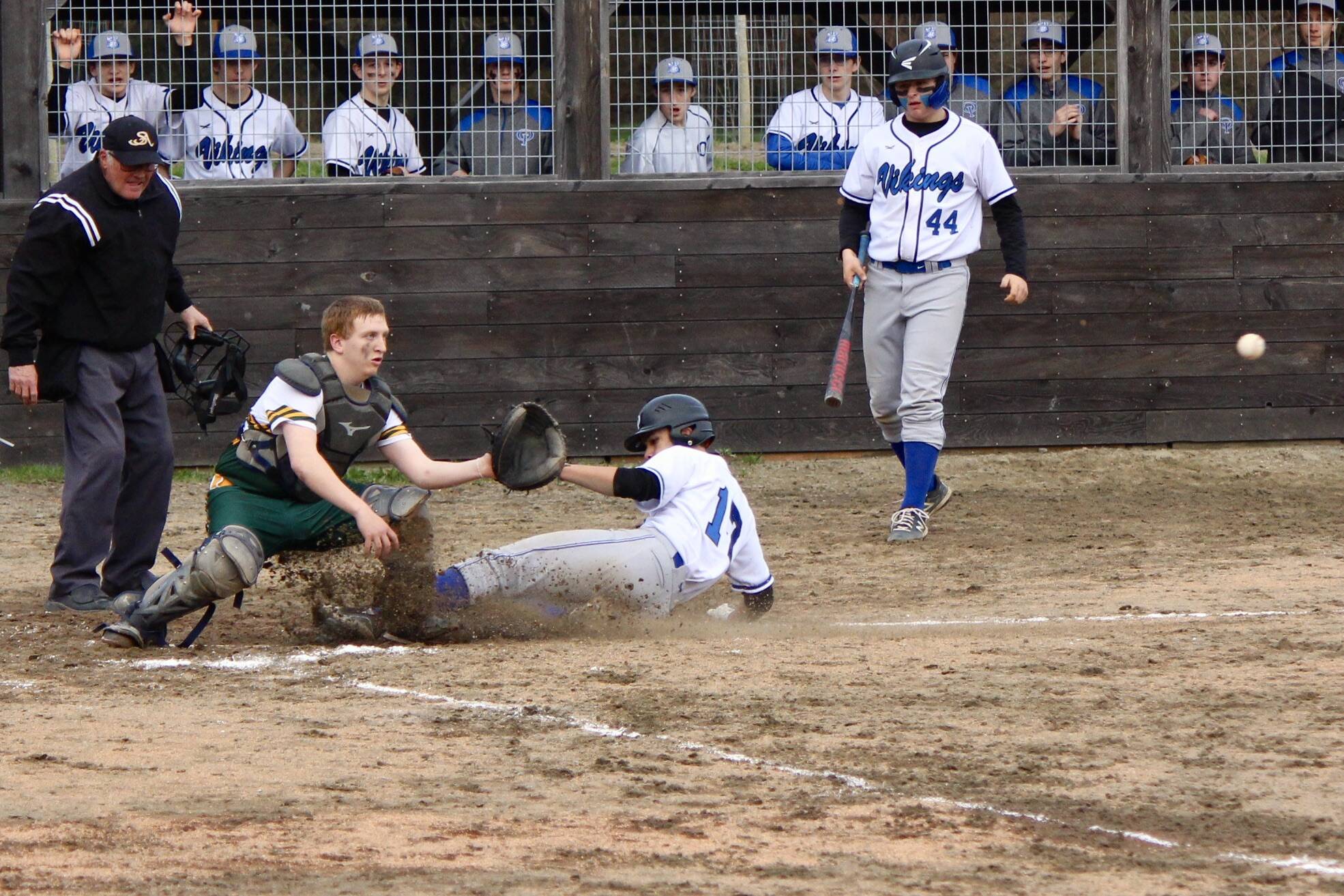 Corey Wiscomb/contributed photo
Remy Lago blazes his way across home plate to score an important run in the late innings during the Vikings’ comeback victory on Friday.