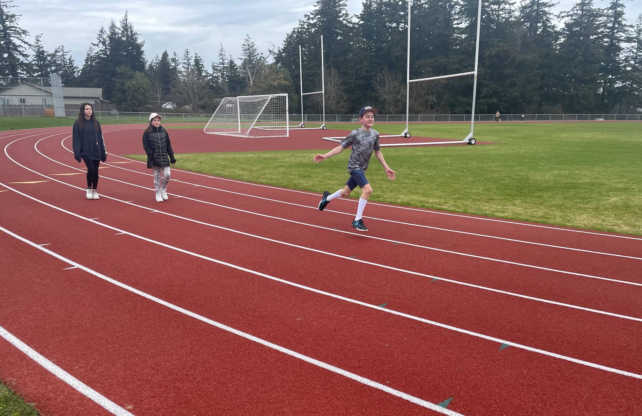 Laura Kussman photo
As the clock approaches 11 a.m., the final hour in the first annual Jog-A-Thons, OISD 5th grader Carter Tilstra completes his final lap of the day. Carter was the top runner for the school logging a total of 126 laps.